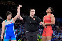 | Photo: AP/Eugene Hoshiko : Nisha Dahiya reacts after the women's freestyle 68kg wrestling quarterfinal match against Sol Gum Pak